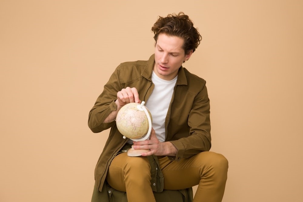 A man holding a globe