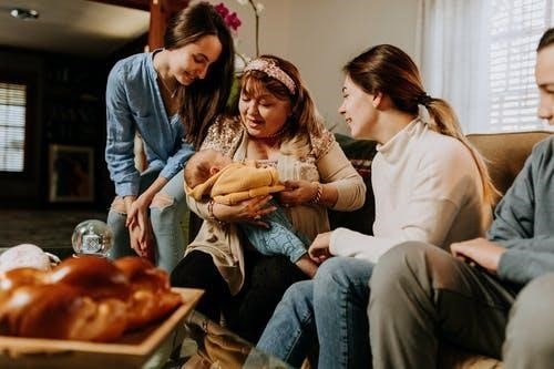 picture showing family playing with baby